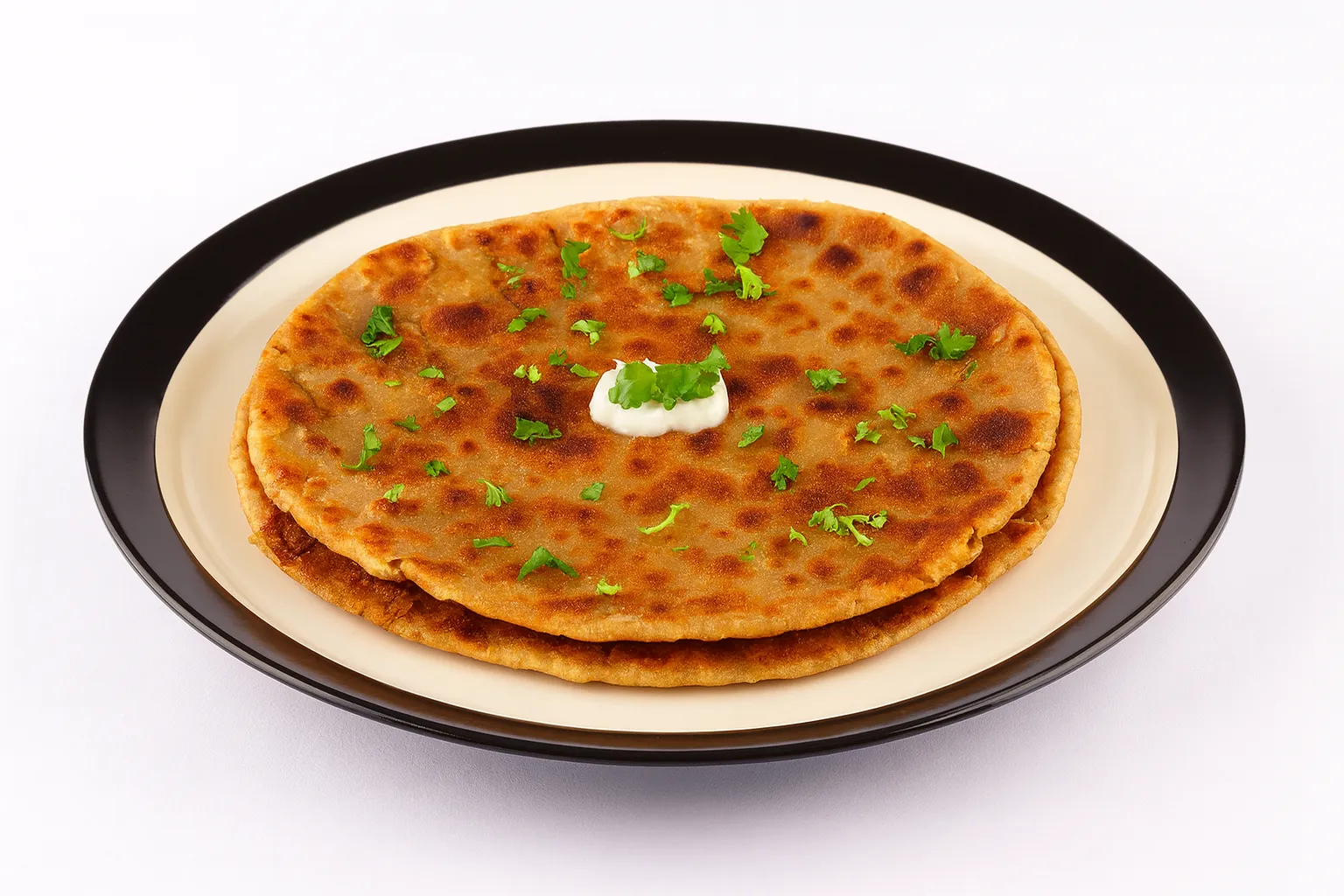 Aloo Paratha - Stuffed potato flatbread at Curries & Puffs Mill Woods Edmonton