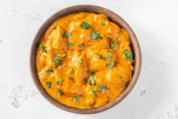 Butter Chicken - Creamy tomato curry at Curries & Puffs Mill Woods Edmonton